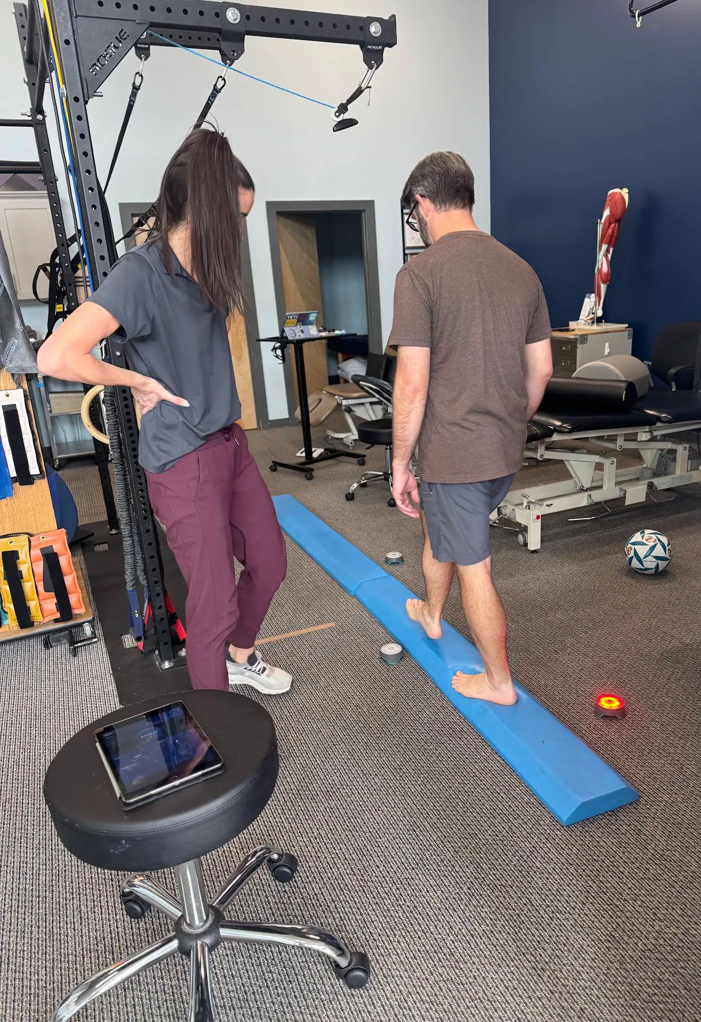 A Beyond Physical Therapy clinician guiding balance training in the Franklin clinic.