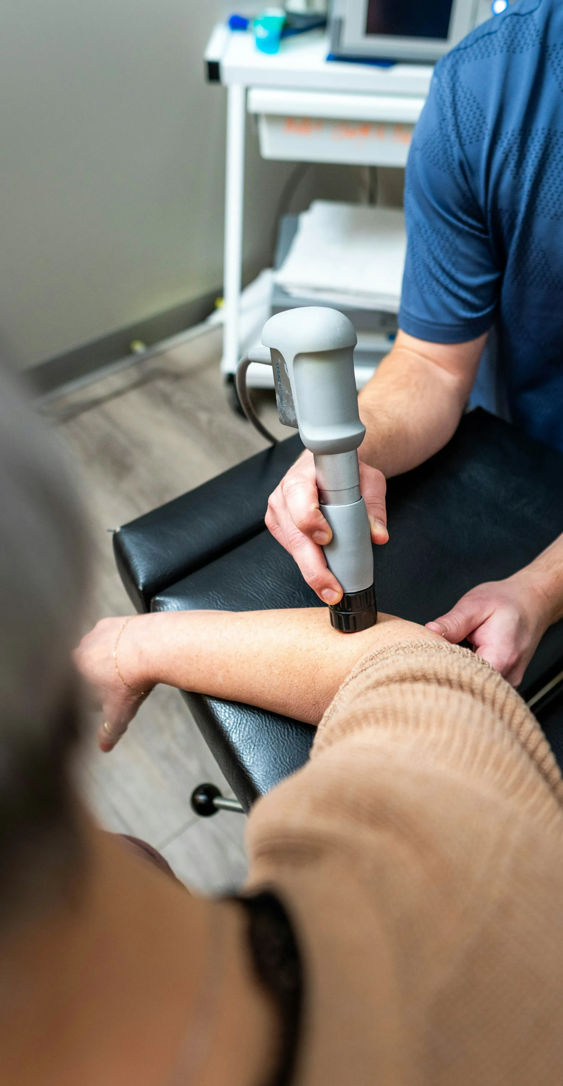 A patient receiving clinical therapy for elbow pain.